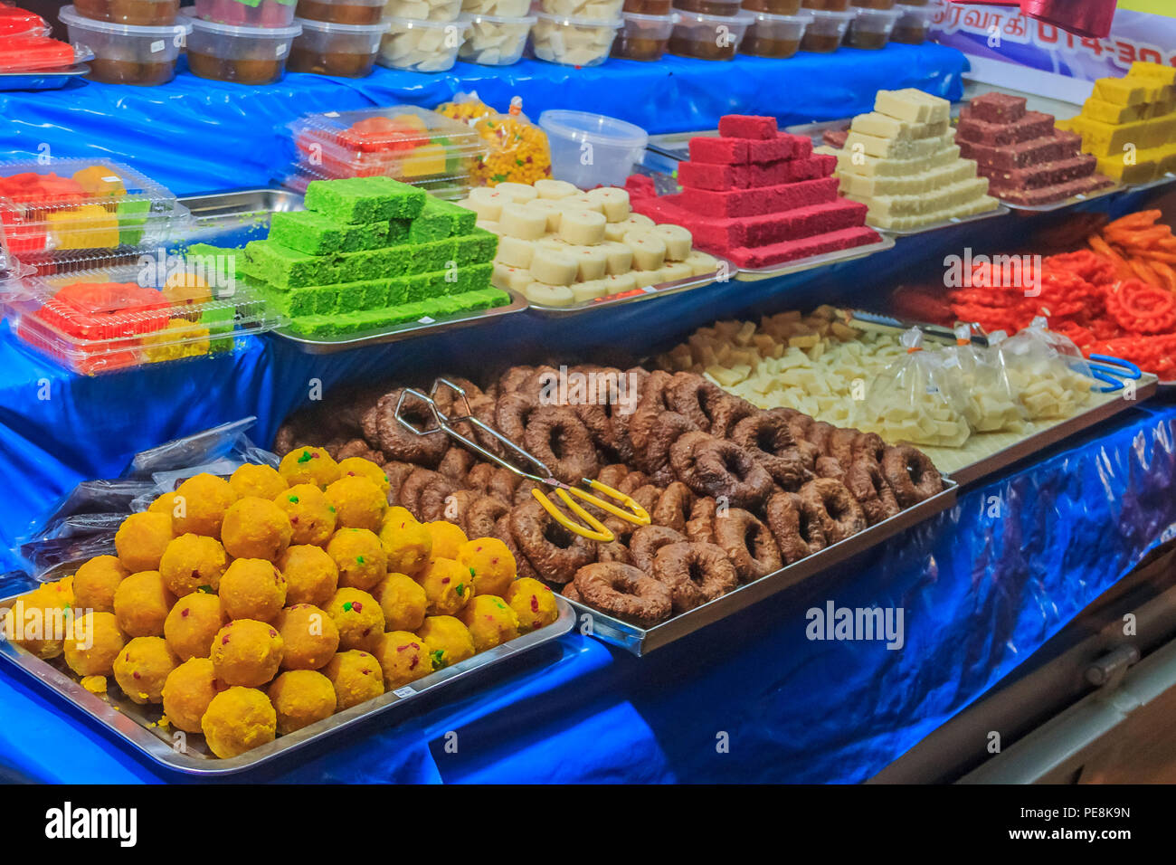 Georgetown, Penang, Malaysia - August 17, 2013: Street food vendor or hawker stall in Penang Georgetown UNESCO heritage zone, selling sweets Stock Photo