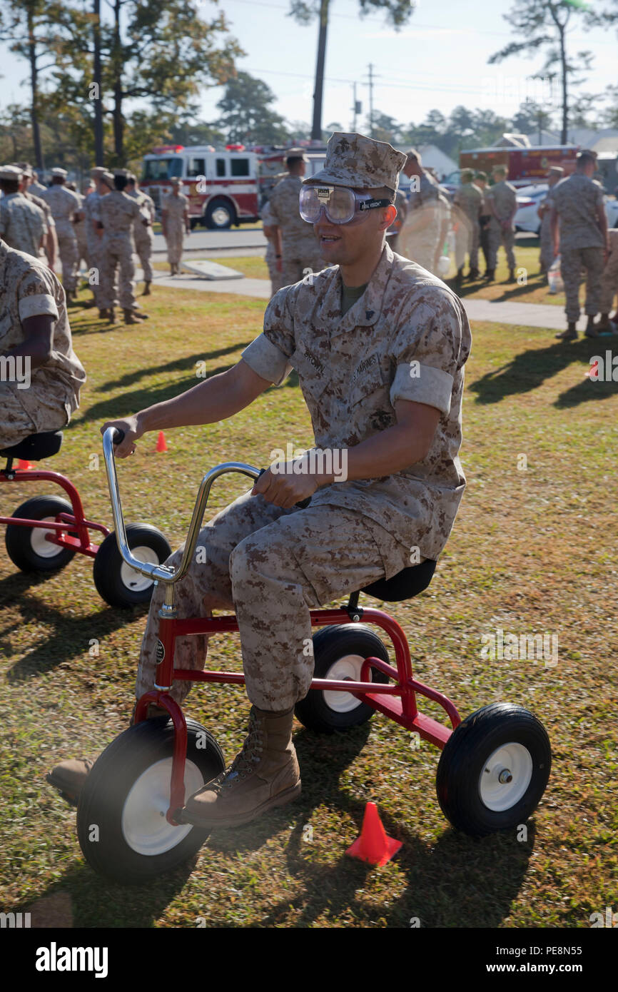 a-student-from-marine-corps-combat-service-support-schools-wears-drunk-goggles-while-riding-a-tricycle-during-the-safety-and-education-fair-held-aboard-camp-johnson-nc-oct-23-2015-marines-attended-the-fair-to-be-educated-about-useful-safety-programs-education-benefits-and-financial-services-us-marine-corps-combat-camera-photo-by-lance-cpl-amy-l-plunkett-released-PE8N55.jpg