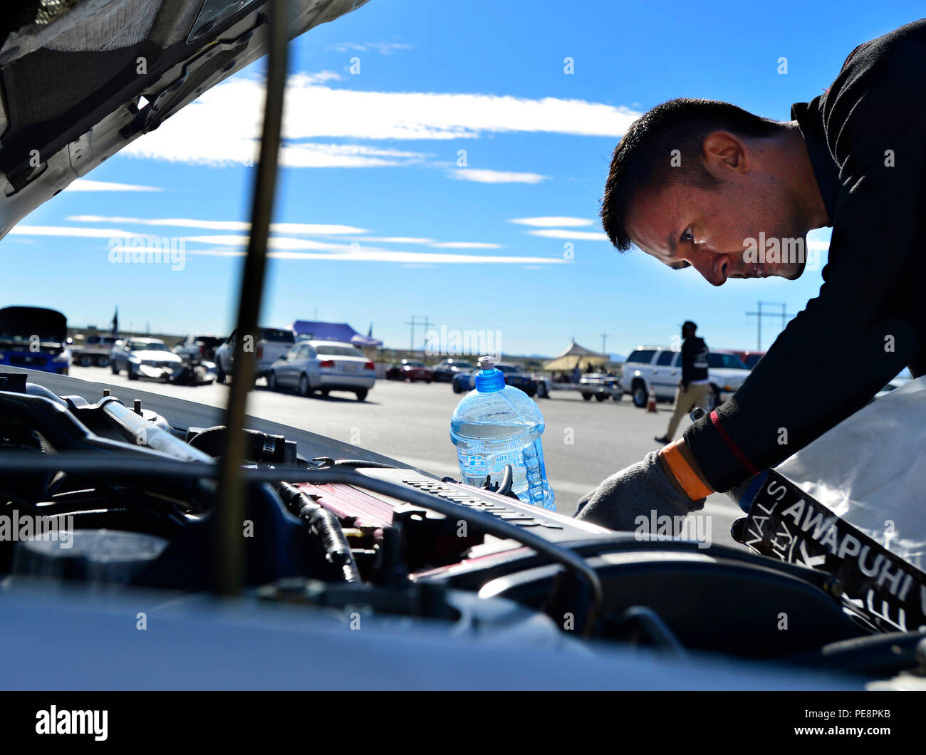 A 432nd Wing MQ-9 Reaper sensor operator inspects his Mitsubishi Lancer ...