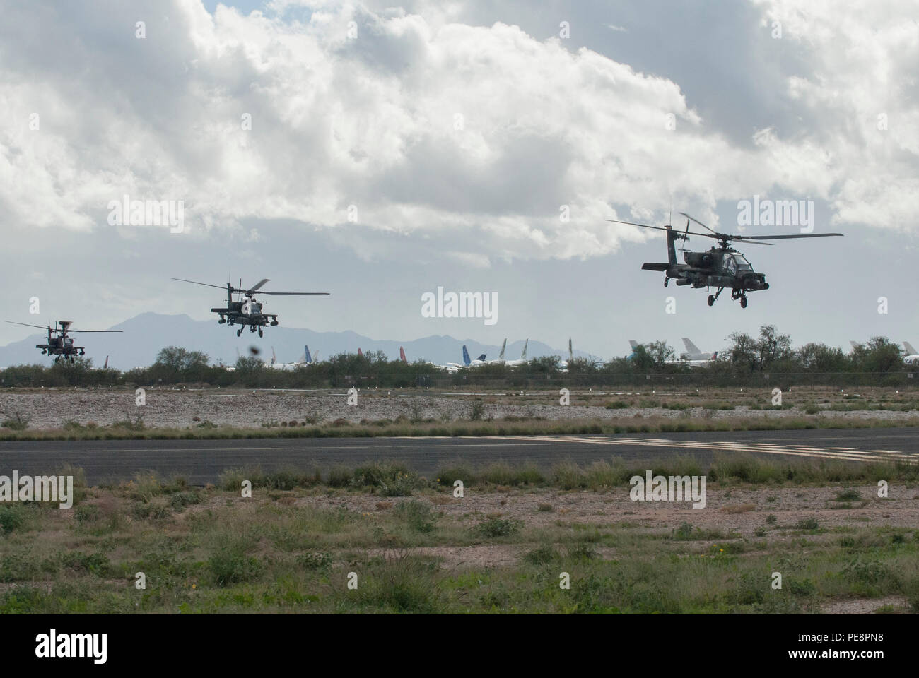 Three Ah 64d Apache Helicopters Take Off From Silverbell Army