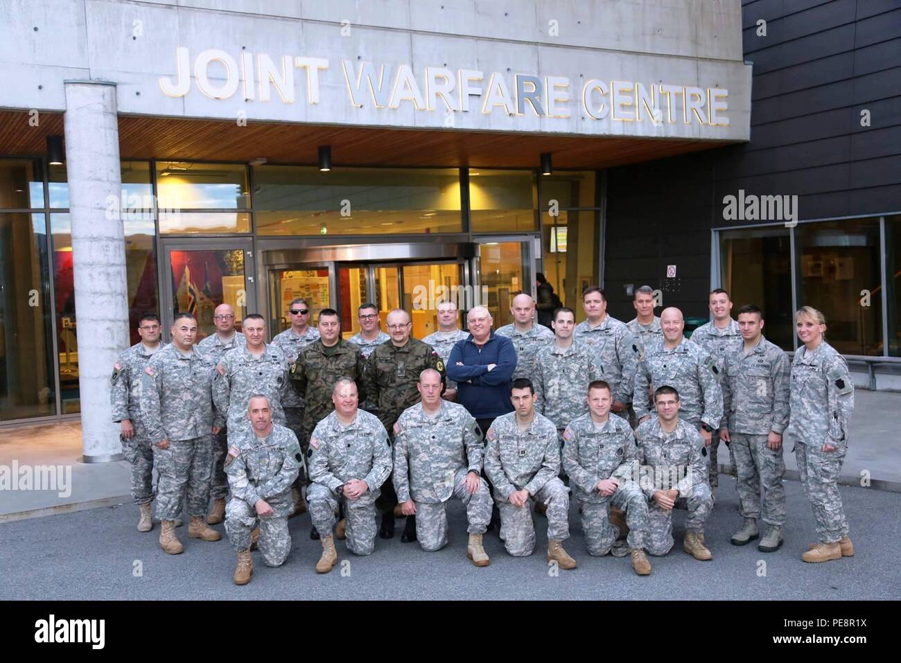 Members of the 28th Infantry Division, Pennsylvania Army National Guard, pose with fellow Trident Juncture 2015 exercise members from the 34th Red Bull Infantry Division of the Minnesota National Guard, 148th Air Support Operations Squadron,193rd Special Operations Wing, Pennsylvania Air National Guard and members of Poland's armed forces during at the Joint Warfare Center. (Photos courtesy of Joint Warfare Centre) Stock Photo