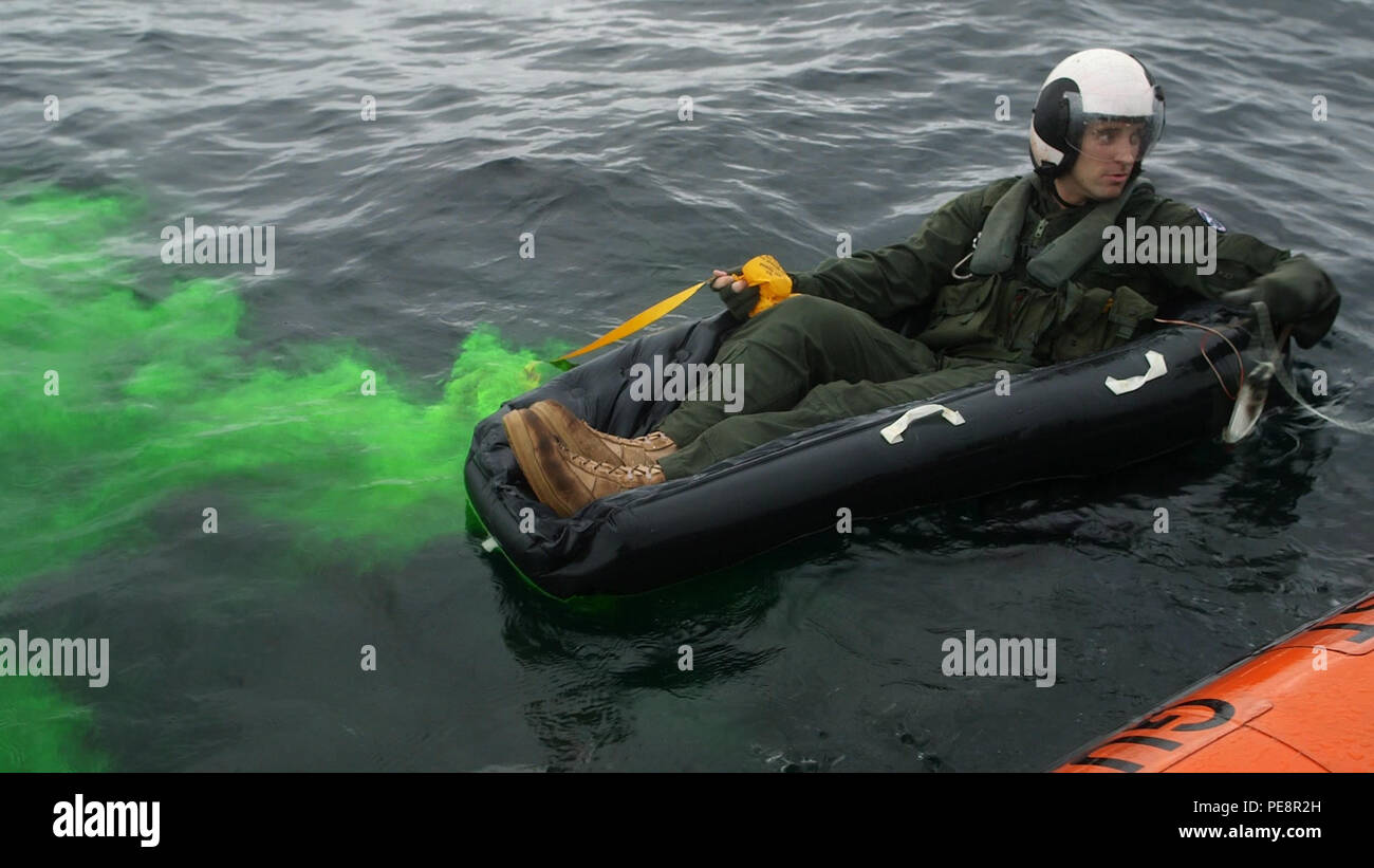 A Marine deploys a sea dye marker during a search and rescue