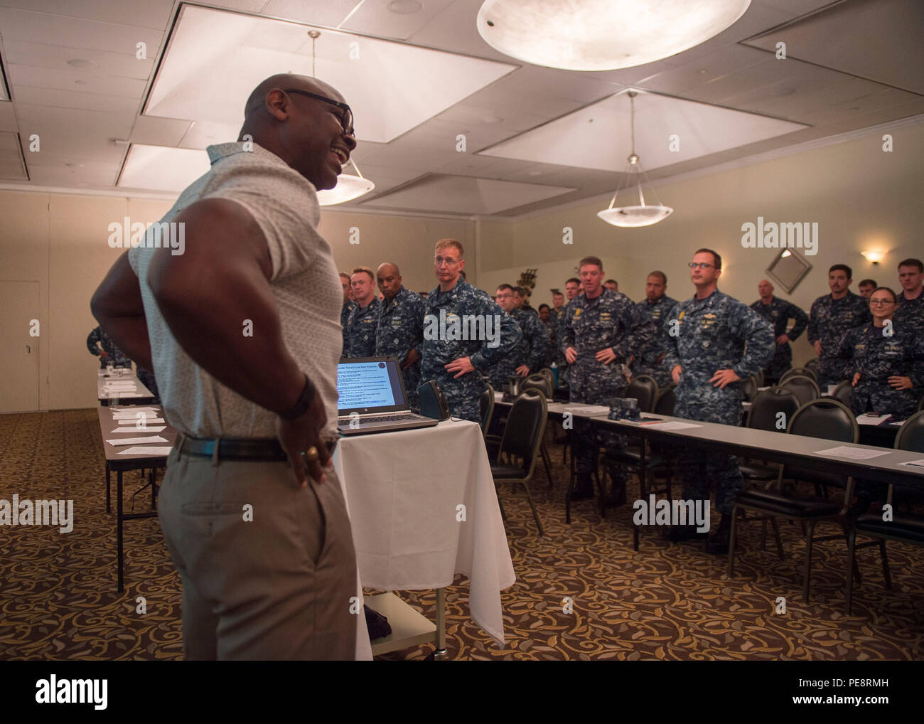 151103-N-IK388-011   SAN DIEGO (Nov. 3, 2015) Dean Harris, left, program analyst for the Navy Physical Readiness Program, leads Sailors in a demonstration on how to measure for waist circumference per the updated physical readiness standards effective Jan.1, 2016, during a Resilient Workforce Summit workshop held at the Anchors Catering and Conference Center on Naval Base San Diego. The annual two-day conference allows Sailors an opportunity to interact with subject matter experts for fleet programs essential to the 21st Century Sailor and Marine Initiative, Sailor 2025 Enriched Culture Pillar Stock Photo