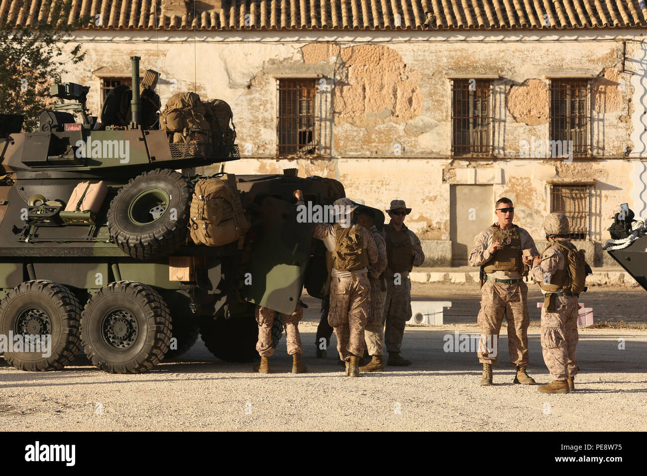 Marines with 4th Light Armored Reconnaissance Battalion perform maintenance checks at a rest stop during a convoy of 14 armored vehicles on their way from Rota, Spain to Almaria Nov. 25. Exercise Trident Juncture is NATO’s largest since 2002 and will include more than 30 nations participating in three host countries. Stock Photo
