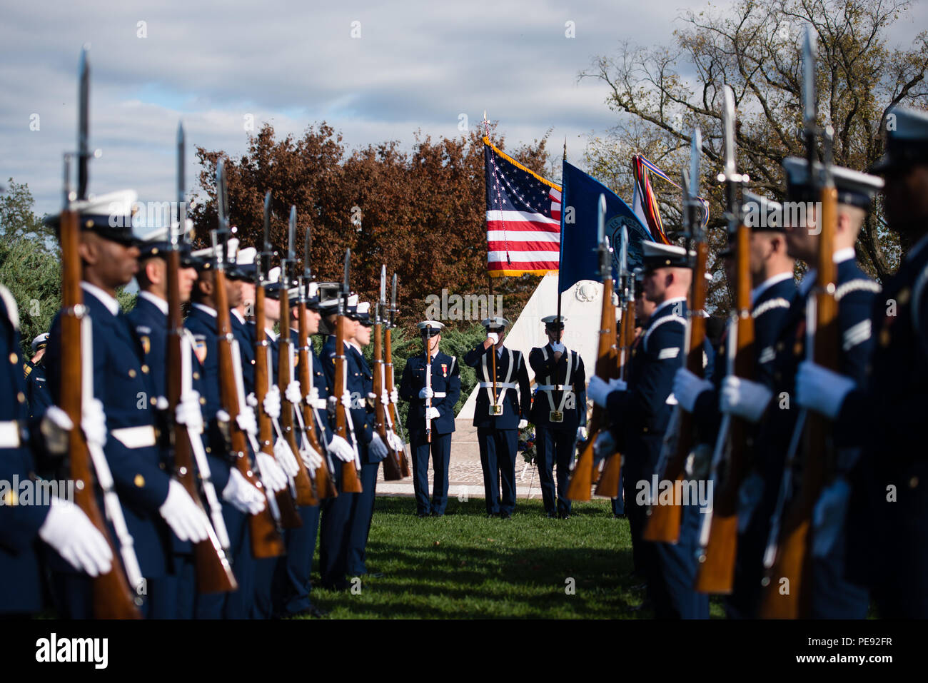 Members of the U.S. Coast Guard Ceremonial Honor Guard participate in wreath-laying ceremony at the Coast Guard Memorial at Arlington National Cemetery, Nov. 11, 2015, in Arlington, Va. Members of the U.S. Coast Guard laid a wreath at the memorial during a ceremony on Veterans Day. (U.S. Army photo by Rachel Larue/Arlington National Cemetery/released) Stock Photo