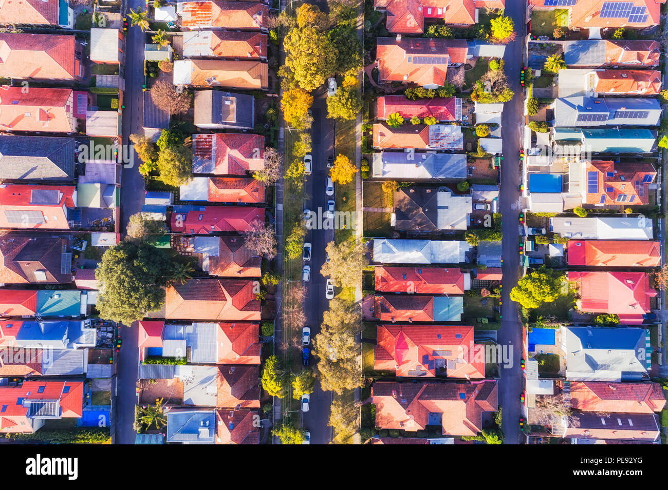 Overhead elevated view down to roof tops of local residential townhouses on quiet streets on wealthy suburbs of Sydney's lower north shore. Stock Photo