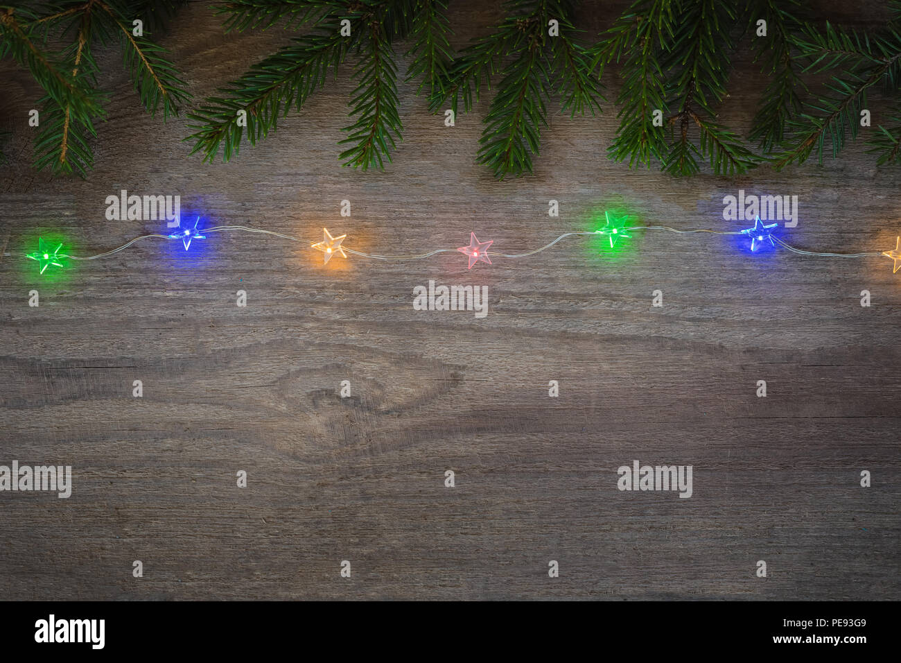 Christmas sparkling Garland with branches of fir tree and cones on the ...
