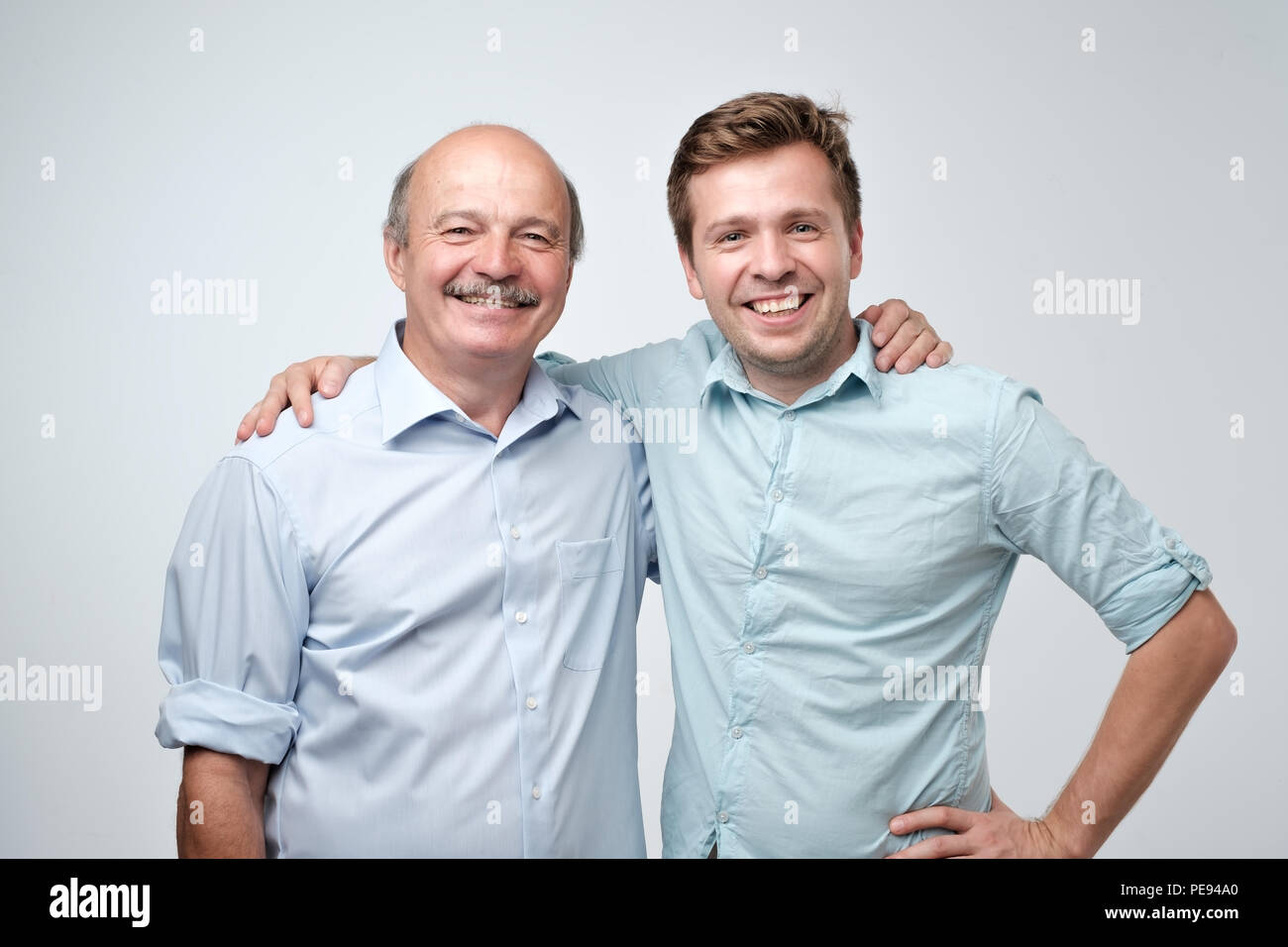 Hispanic father hugging adult son hi-res stock photography and images ...