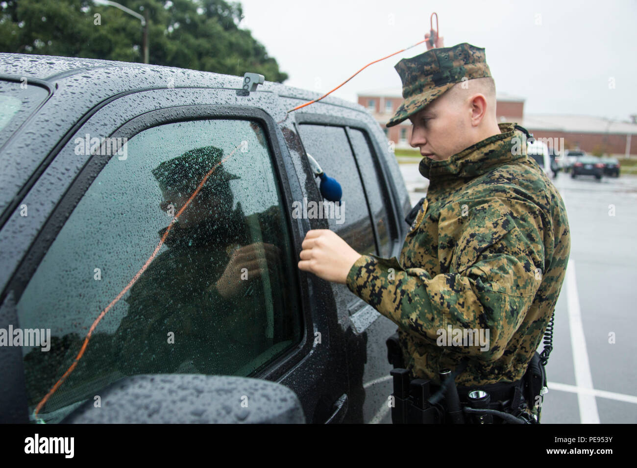 U.S. Marine Corps Sgt. Timothy Meppen, a military police patrolman with  Provost Marshal's Office (PMO), Marine Corps Installations East, Marine  Corps Base Camp Lejeune, opens a locked vehicle for a Marine on