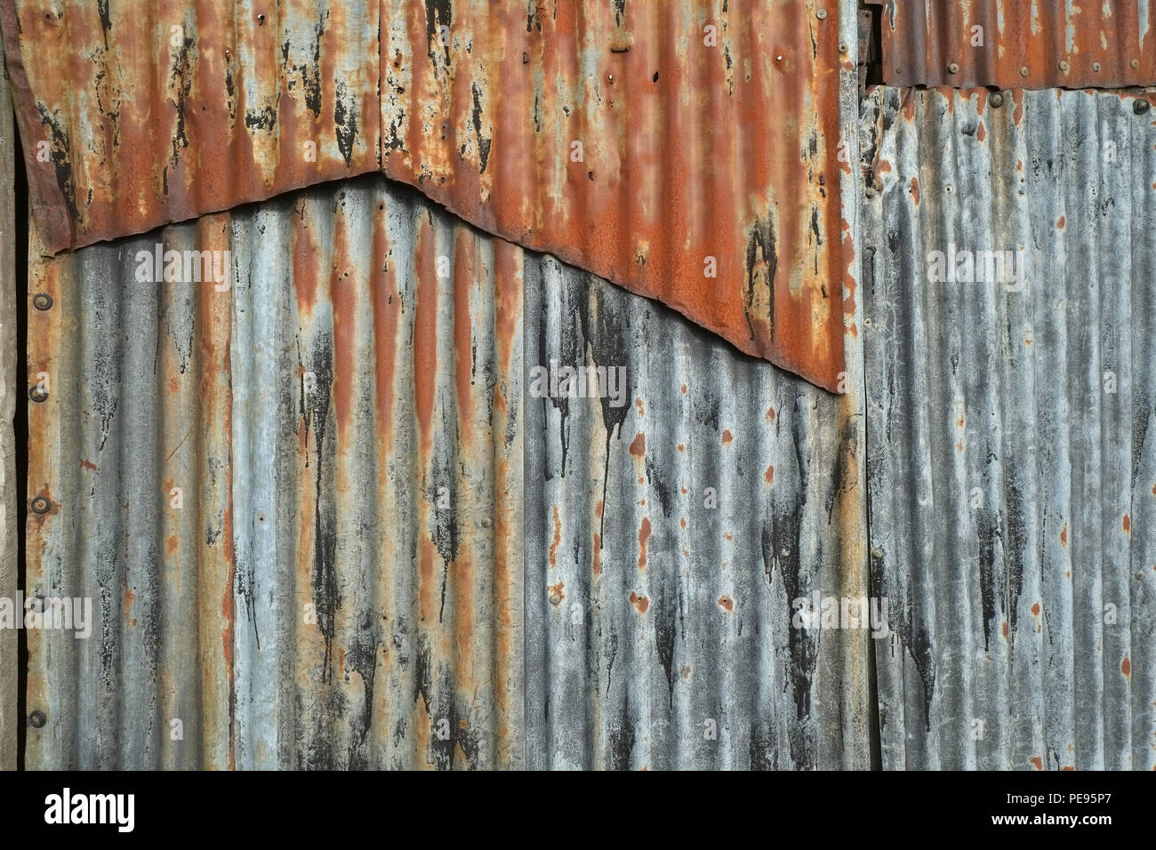 Rusting corrugated iron barn wall Stock Photo