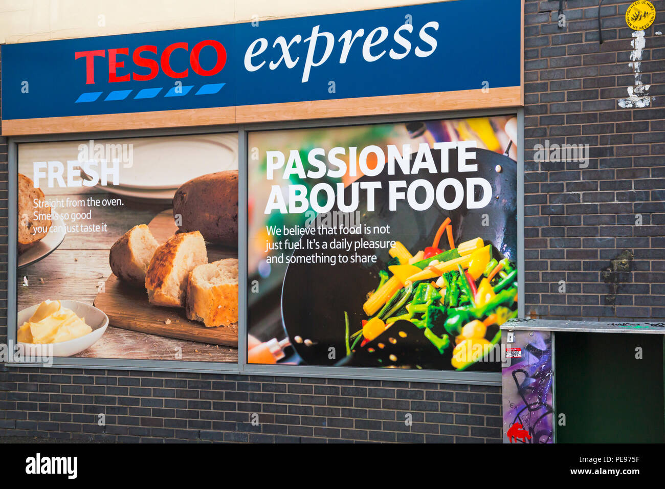 Tesco Express at North Street, Bedminster, Bristol on a wet rainy day  in August - passionate about food Stock Photo
