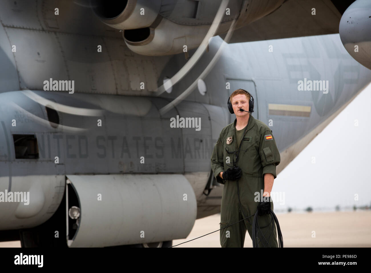 Sgt. Hayden Frank, a crew master with Special-Purpose Marine Air-Ground Task Force Crisis Response-Africa, performs final checks before departure on a KC-130J Hercules in Zaragoza, Spain, Nov. 11. The Marines spent a week training with Spanish counterparts, providing air delivery of gear and personnel, Nov. 9-13. (U.S. Marine Corps photo by Staff Sgt. Vitaliy Rusavskiy) Stock Photo