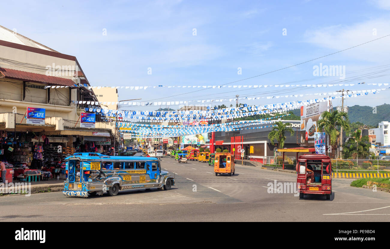 Tacloban City, Philippines - June 12, 2018: View Of Jeepneys And Downtown Tacloban City Stock Photo
