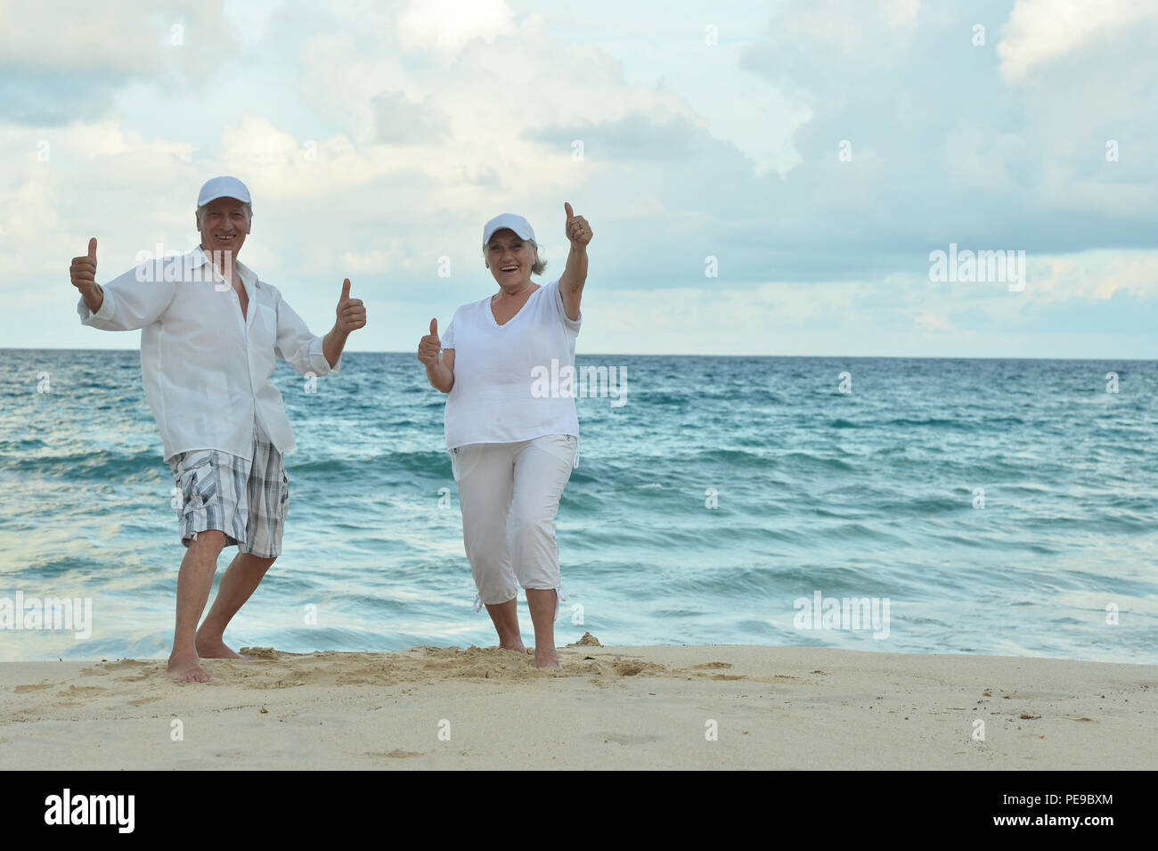 Portrait of a elderly couple resting on tropical resort Stock Photo - Alamy
