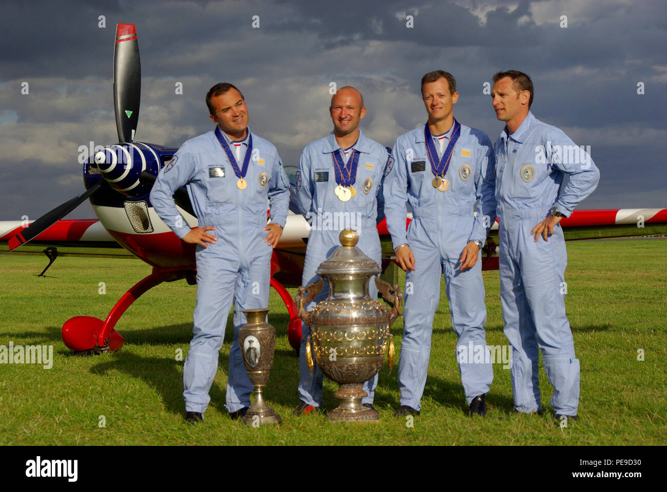 French aerobatic team at the World Aerobatics Championships WAC at Silverstone, UK. Winners with trophy, trophies. Renaud Ecalle, Francois Le Vot Stock Photo