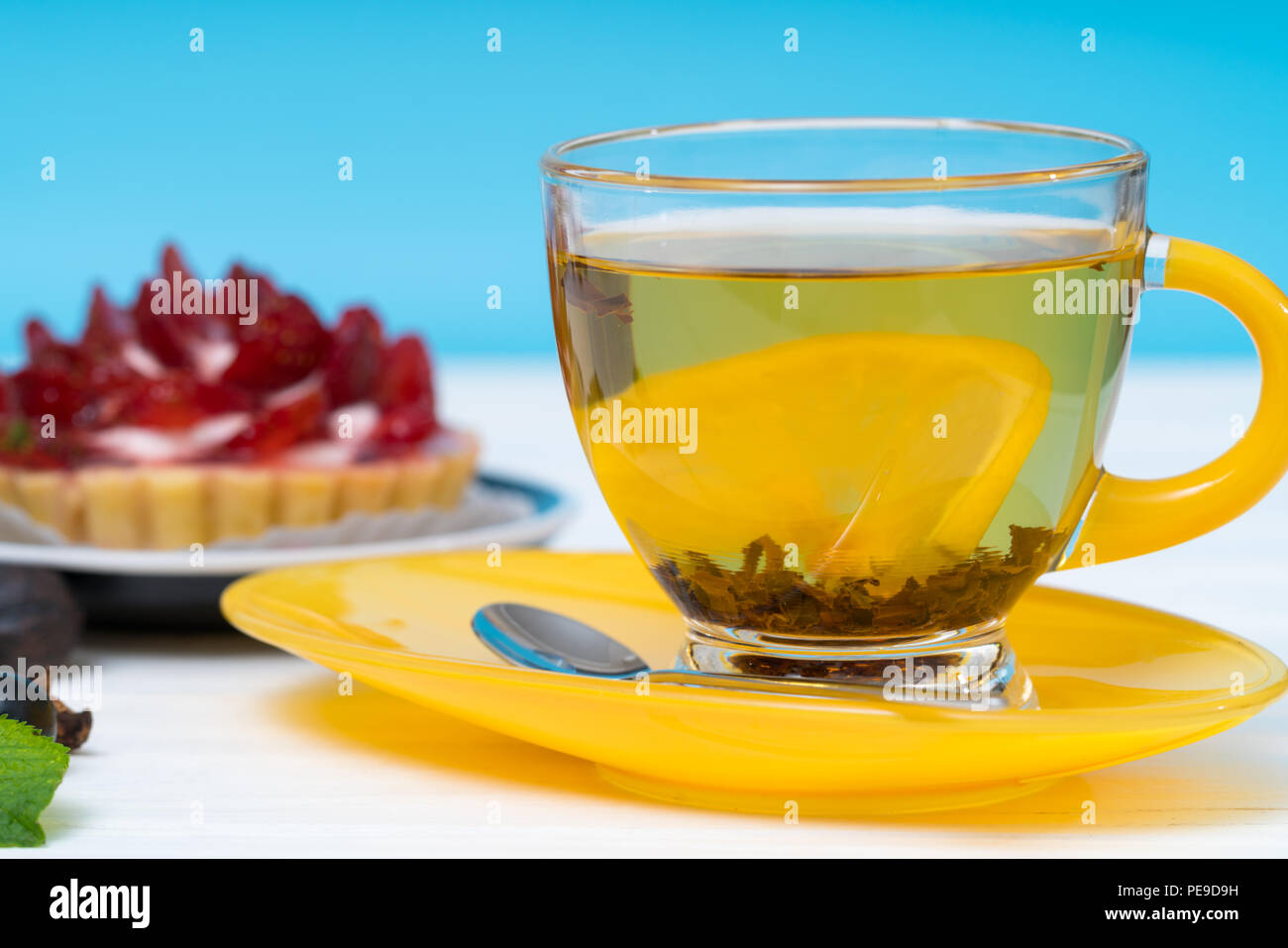 Spicy hot lemon tea steeping in the cup Stock Photo