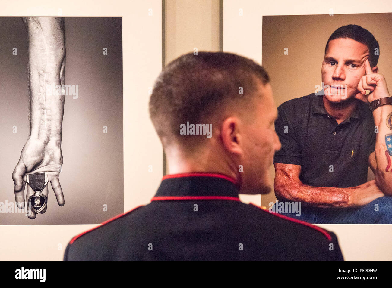 U.S. Marine Cpl. Kyle Carpenter observes his portrait at the National Portrait Gallery in Washington, D.C., Nov. 15, 2015. Carpenter is the youngest living Medal of Honor recipient. (DoD photo by D. Myles Cullen/Released) Stock Photo