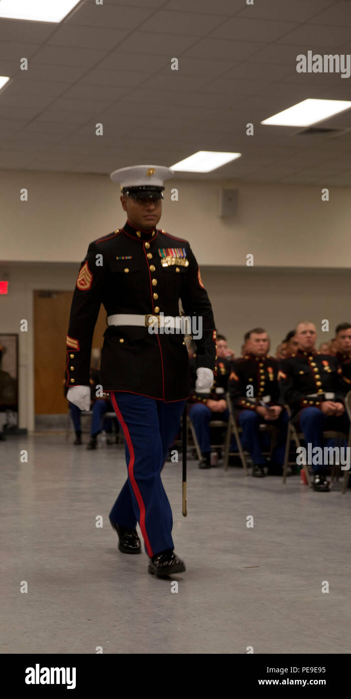 A U.S. Marine from Marine Corps Combat Service Support Schools, adjutant, marches into place during the Logistics Operations School Marine Corps Ball held aboard Camp Johnson, N.C., Nov. 8, 2015. Students attended their first Marine Corps Ball to celebrate the 240th Marine Corps Birthday. (U.S. Marine Corps Combat Camera photo by Lance Cpl. Amy L. Plunkett/ Released) Stock Photo