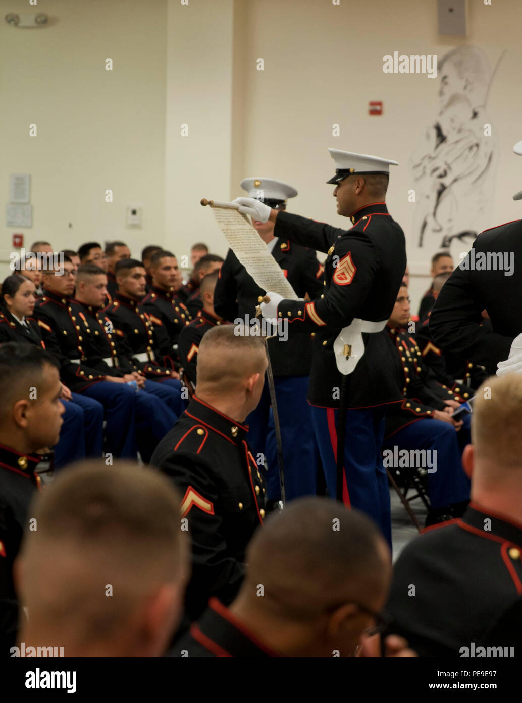 A U.S. Marine from Marine Corps Combat Service Support Schools, adjutant, reads the General John