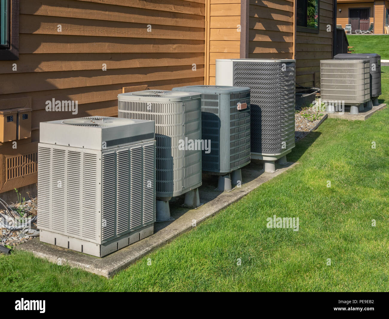 Air conditioning units outside an apartment complex Stock Photo Alamy