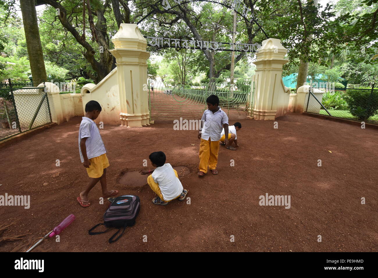 The Patha Bhavana students are playing in front of the gateway of the Santiniketan Griha, Visva-Bharati university, Santiniketan, Bolpur in the Birbhu Stock Photo