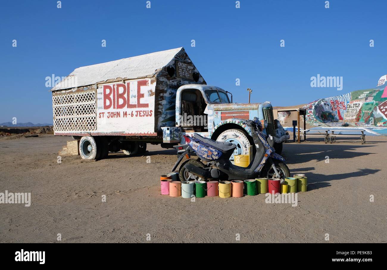 Truck and scooter at Salvation Mountain folk art installation near Slab City and Niland, California,United States. Stock Photo