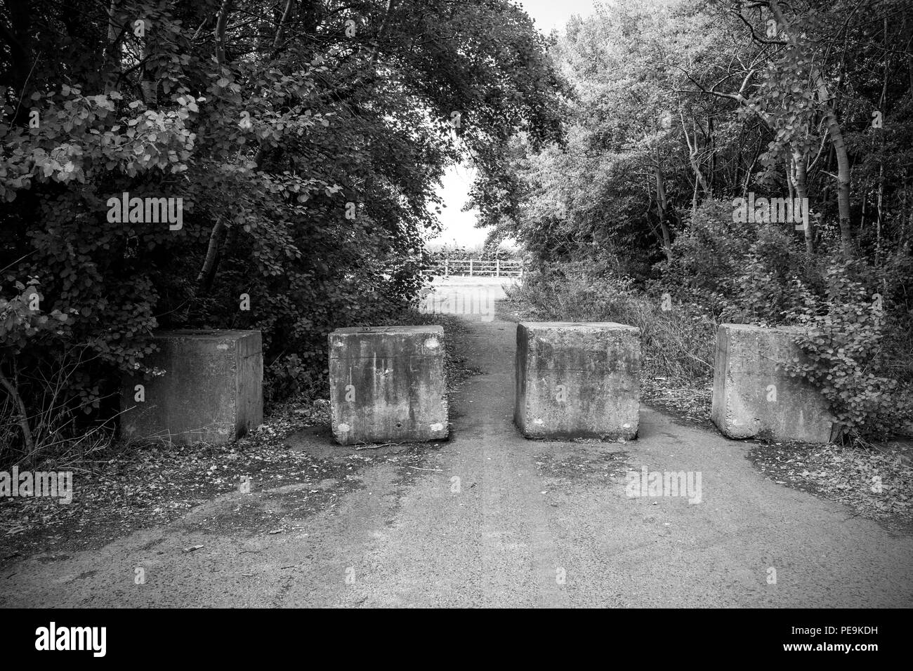 Concrete boulders to stop travellers set up camp in Cheshire UK Stock Photo