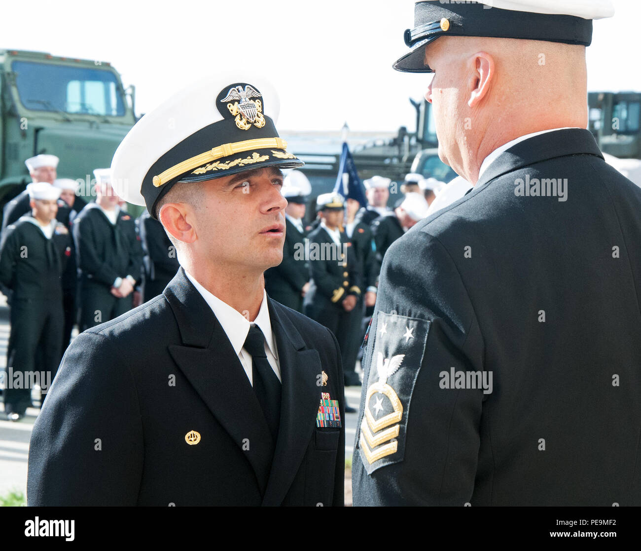 151110-N-ZZ999-057 SAN DIEGO (Nov. 11, 2015) – Capt. Gregory Vinci,  commanding officer of Amphibious Construction Battalion (ACB) 1, inspects  Command Master Chief Douglas Heiner in his service dress blue uniform on the