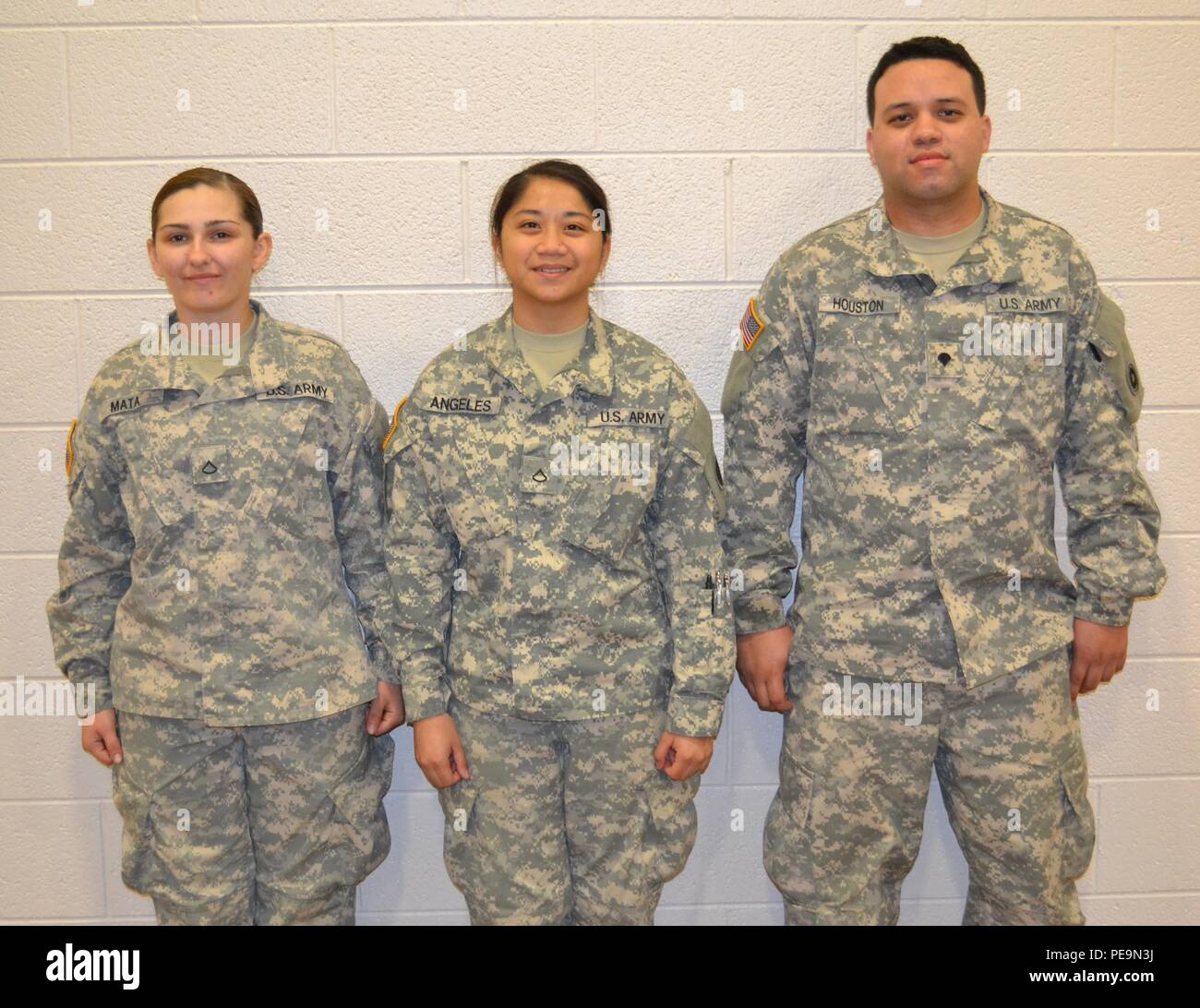 Pfc. Genephere Mata, Pfc. Kassandra Angeles and Spc. Marcos Houston, members of the 650th Regional Support Group, participated in a Joint Culinary Training Program exercise at the George W. Dunaway Army Reserve Center in Sloan, Nev., Nov. 15, where they trained and learned extra culinary skills at this event. Stock Photo