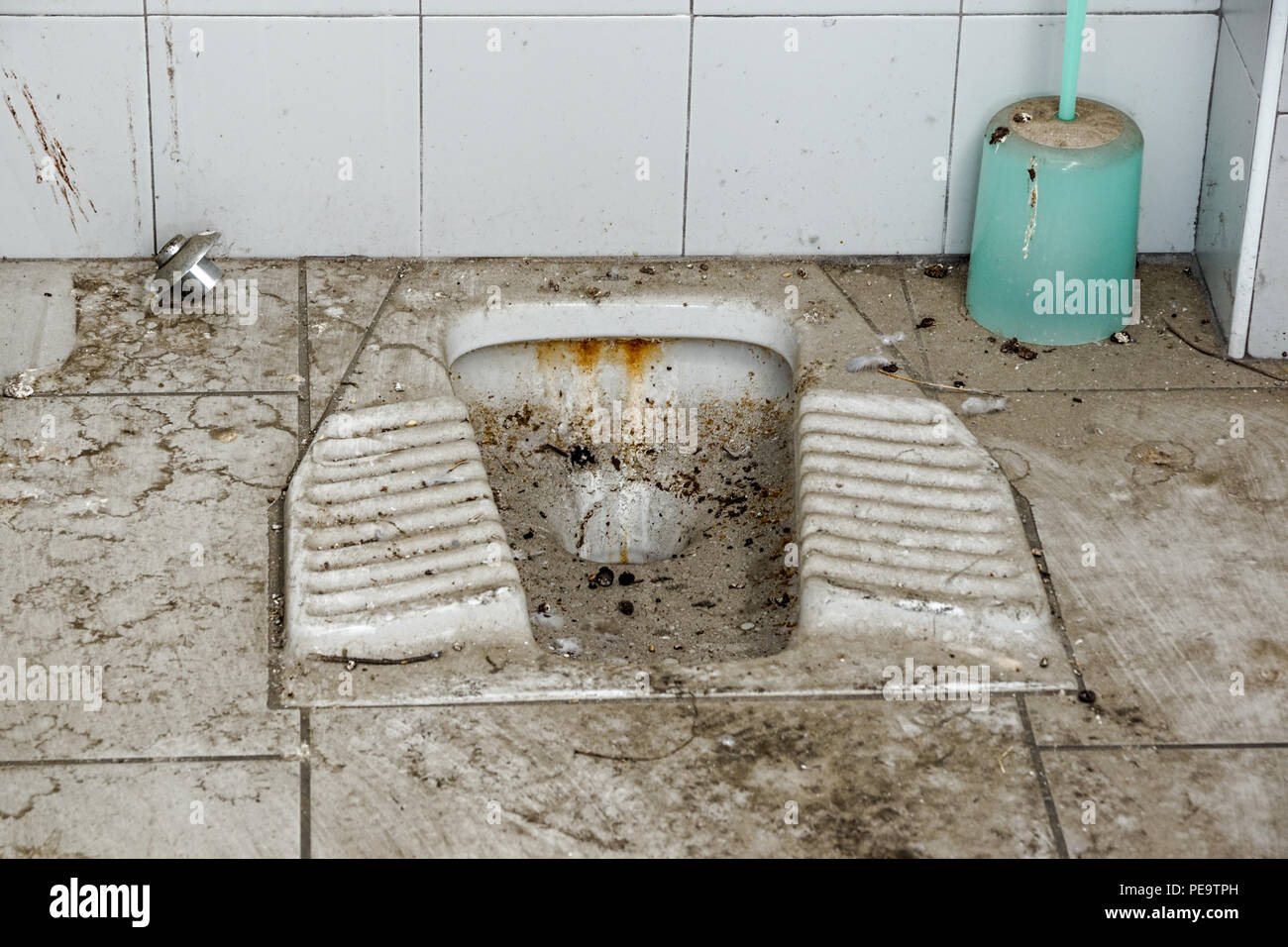 abandoned old toilet in building destroyed, interior industrial farm . Stock Photo