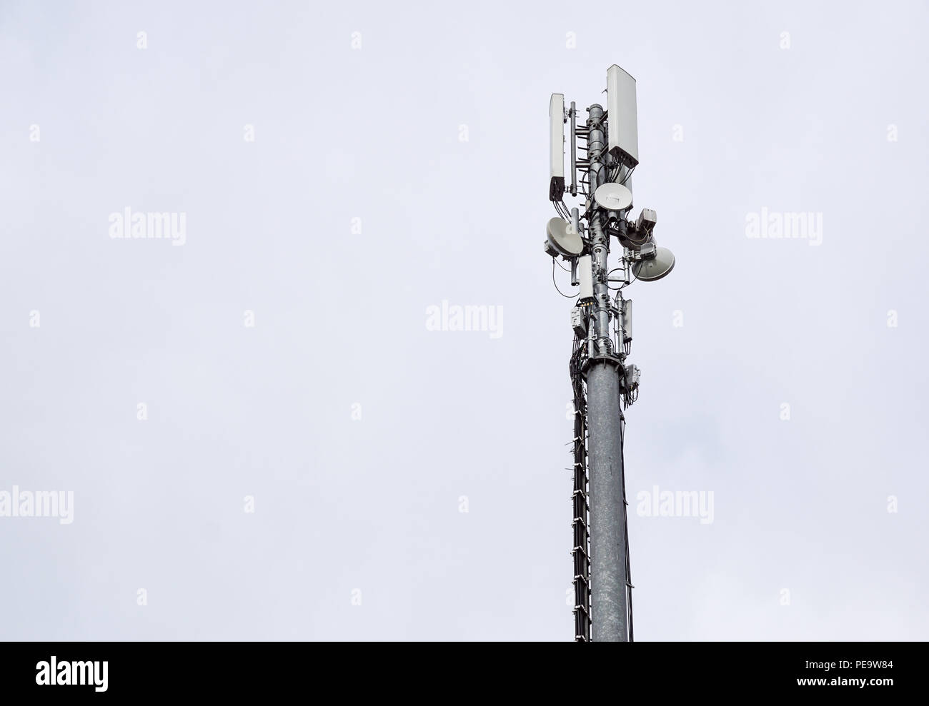 Technology on the top of the telecommunication GSM. Masts for mobile phone signal. Tower with antennas of cellular communication . Stock Photo