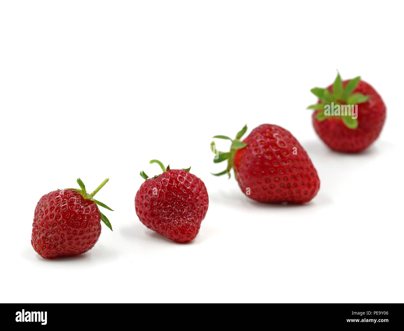 Fresh strawberrys with depth of field isolated on white background Stock Photo