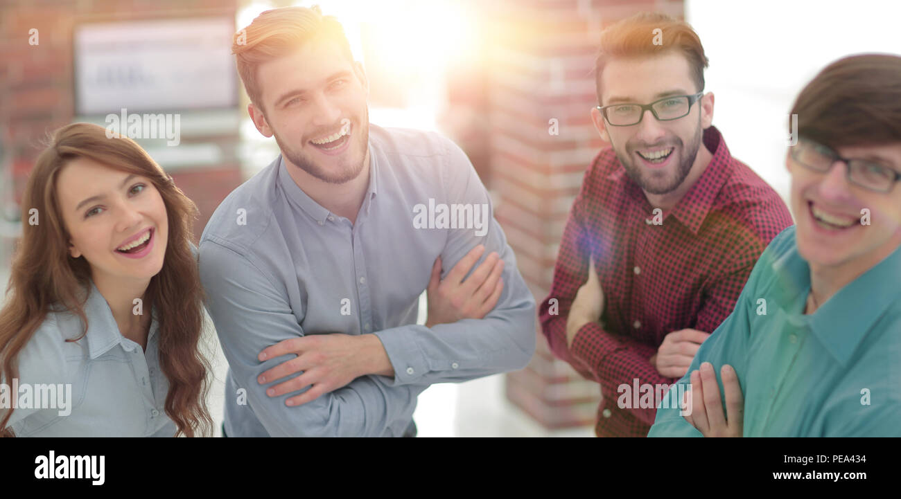Happy smiling business team in office Stock Photo - Alamy