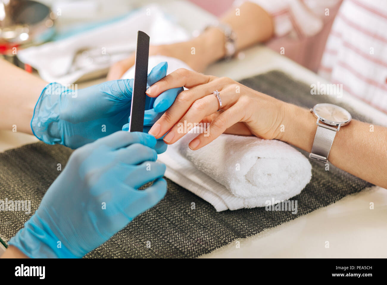 Female hands treating female hands clouse up Stock Photo