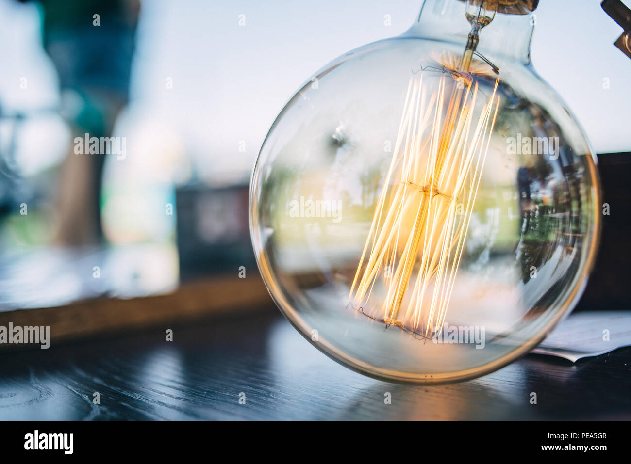 hanging retro incandescent bulb, heat light lamp, antique Stock Photo