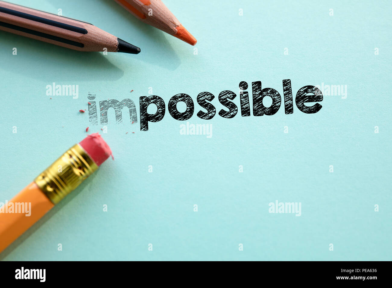 Making impossible in to possible by eraser Stock Photo