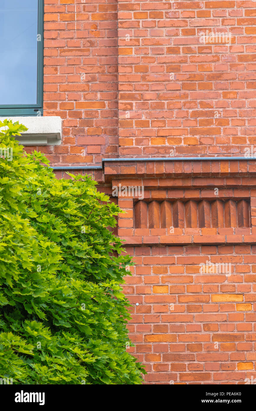 Image showcasing Brick facade of a renovated industrial building Stock Photo - Alamy