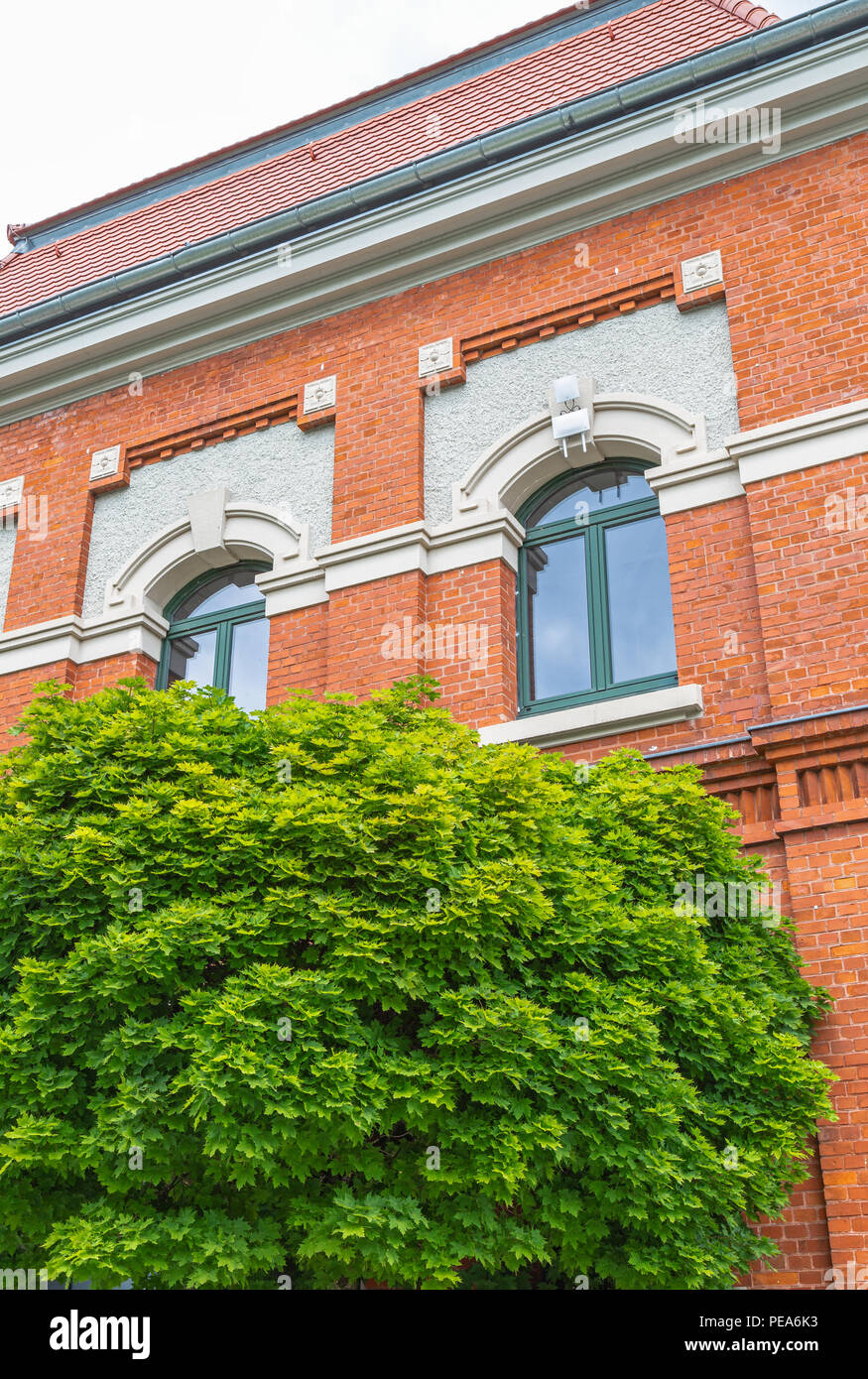 View of Brick facade of a renovated industrial building Stock Photo - Alamy