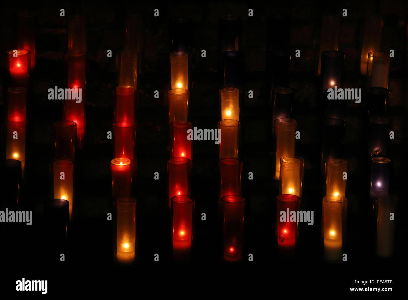 Burning candles in the dark. All Saints Day, All Hallows Eve, Christmas