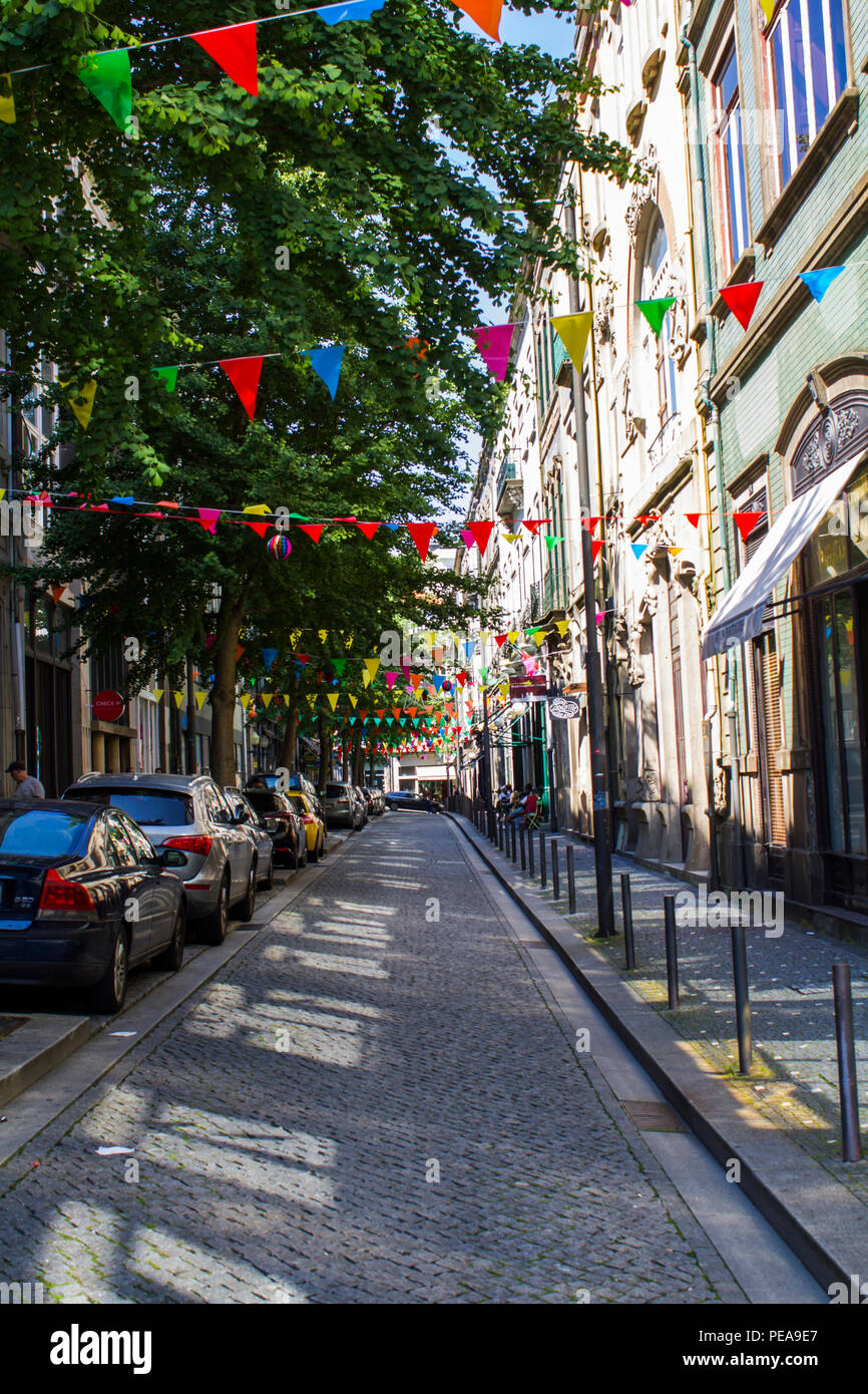 Porto, Portugal - CIRCA, June 2018: Street decorated with flags for popular saints festival Stock Photo