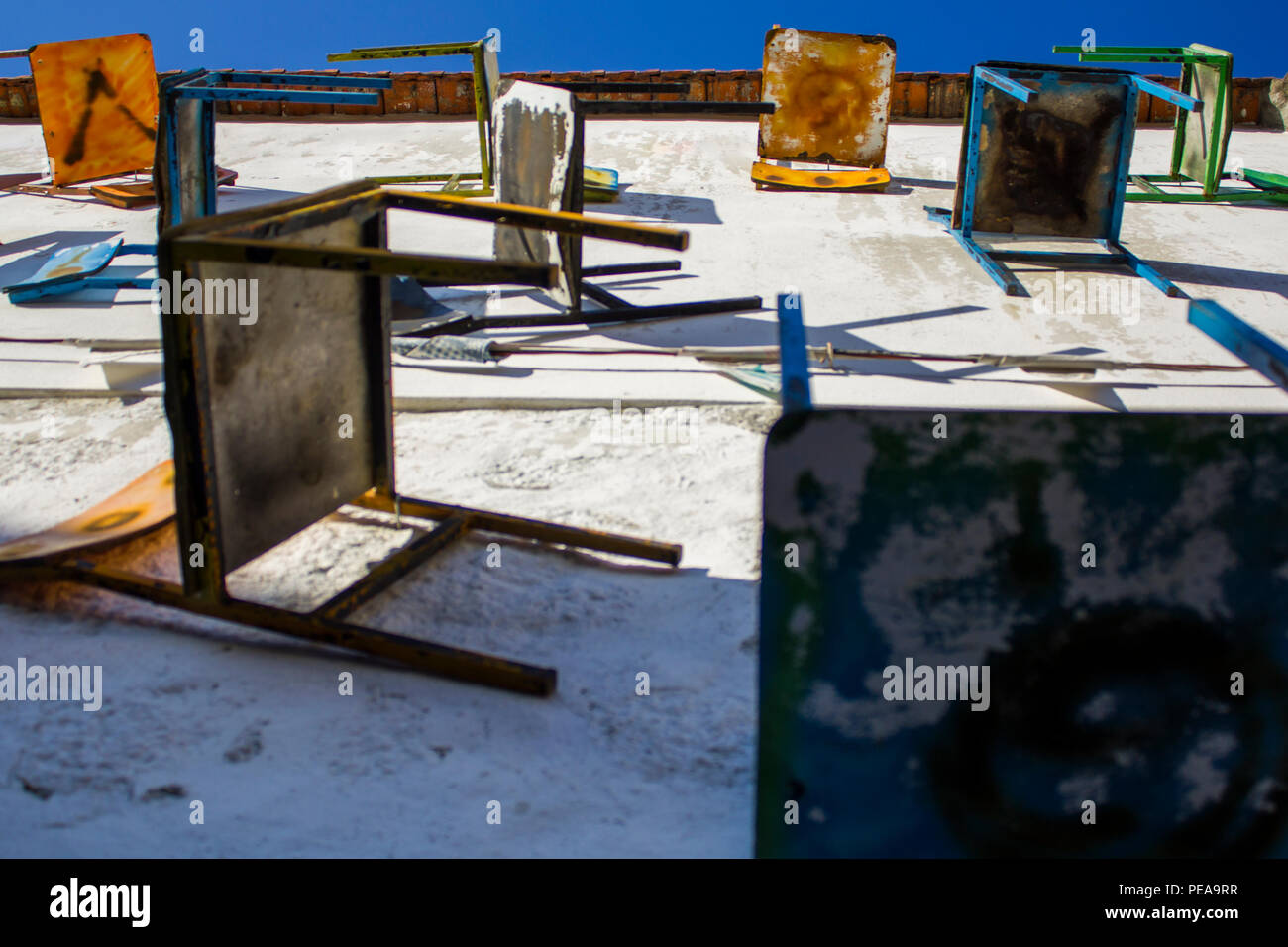 Chairs hanging on wall Stock Photo Alamy