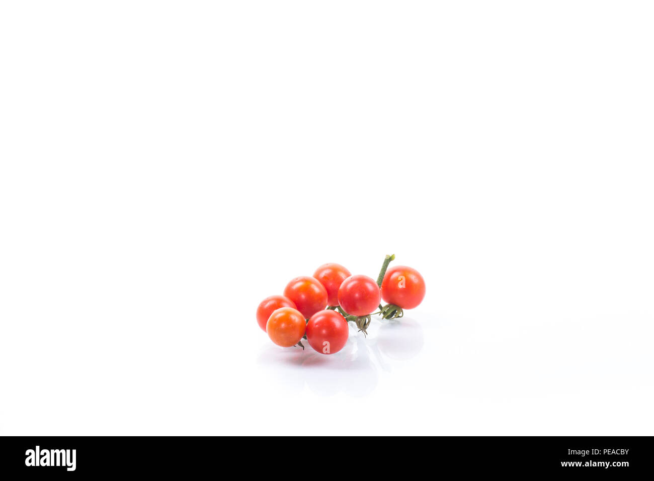 small ripe red cherry tomatoes isolated on white background Stock Photo ...