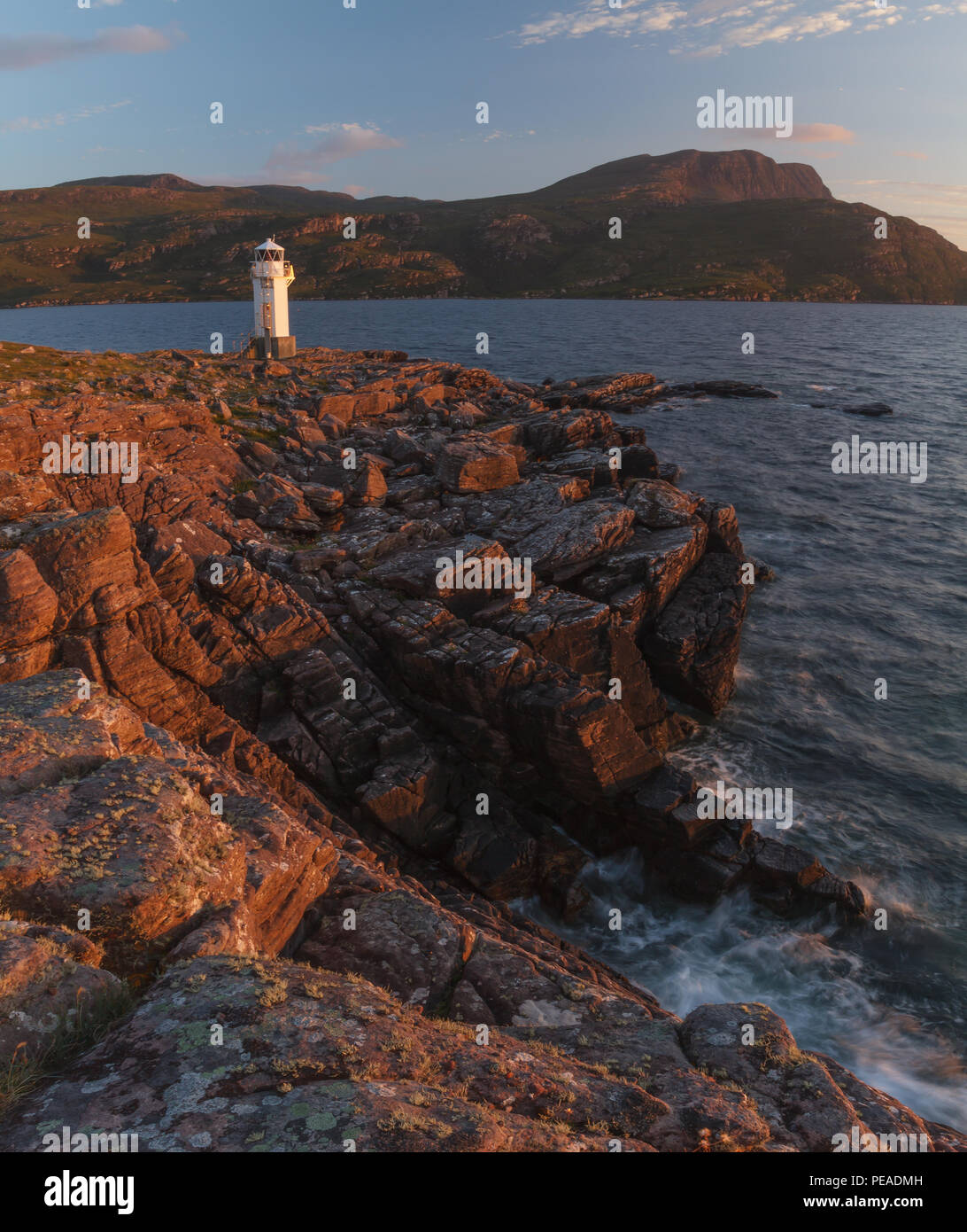 Rhue Lighthouse, Ullapool, Scotland, at sunset in summer Stock Photo