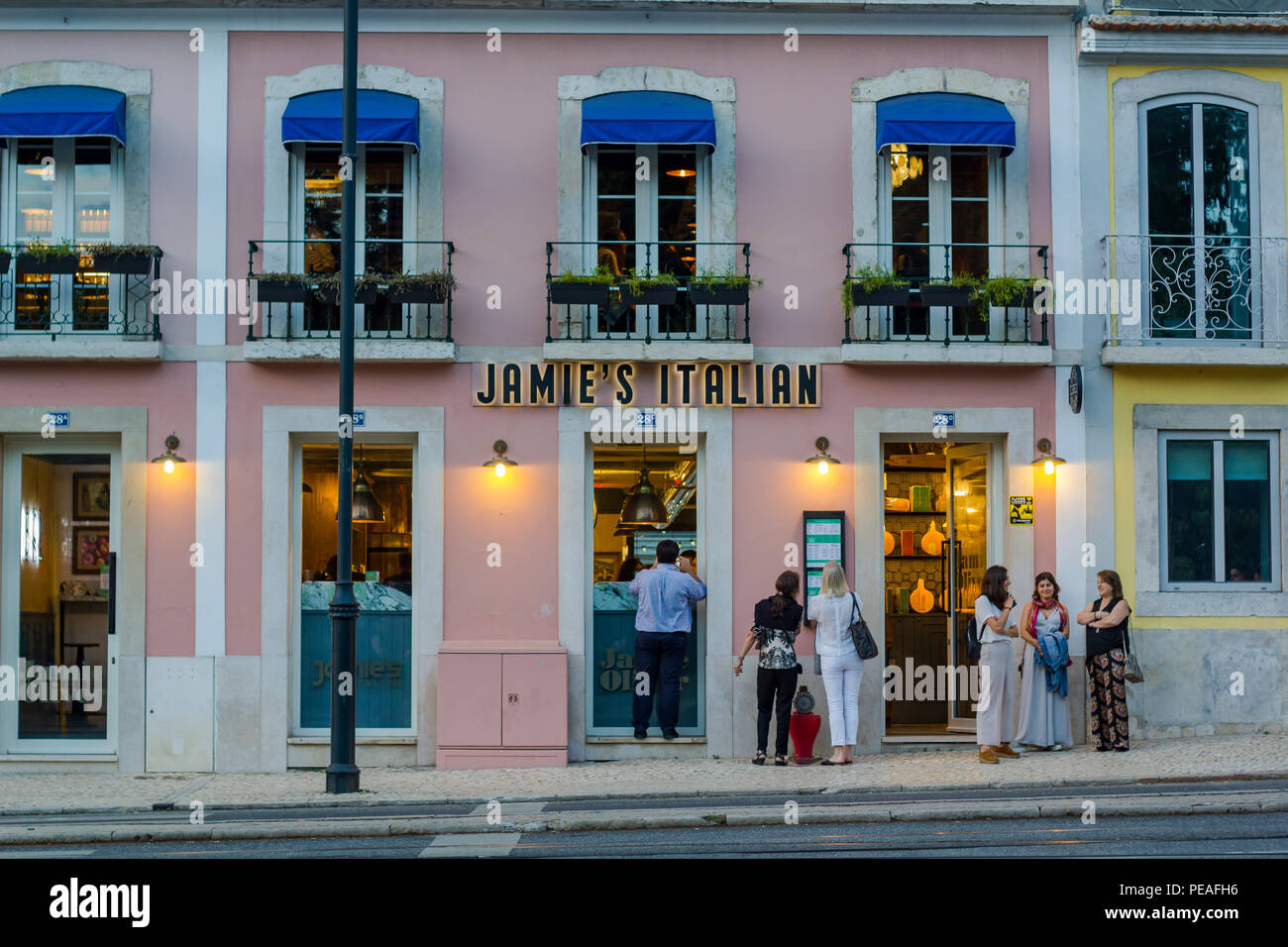 People waiting outside Jamie Oliver italian restaurant in Lisbon Stock Photo