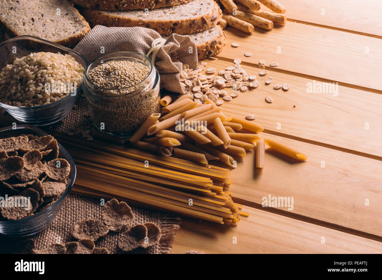 Wooden table full of fiber-rich whole foods, perfect for a balanced diet Stock Photo