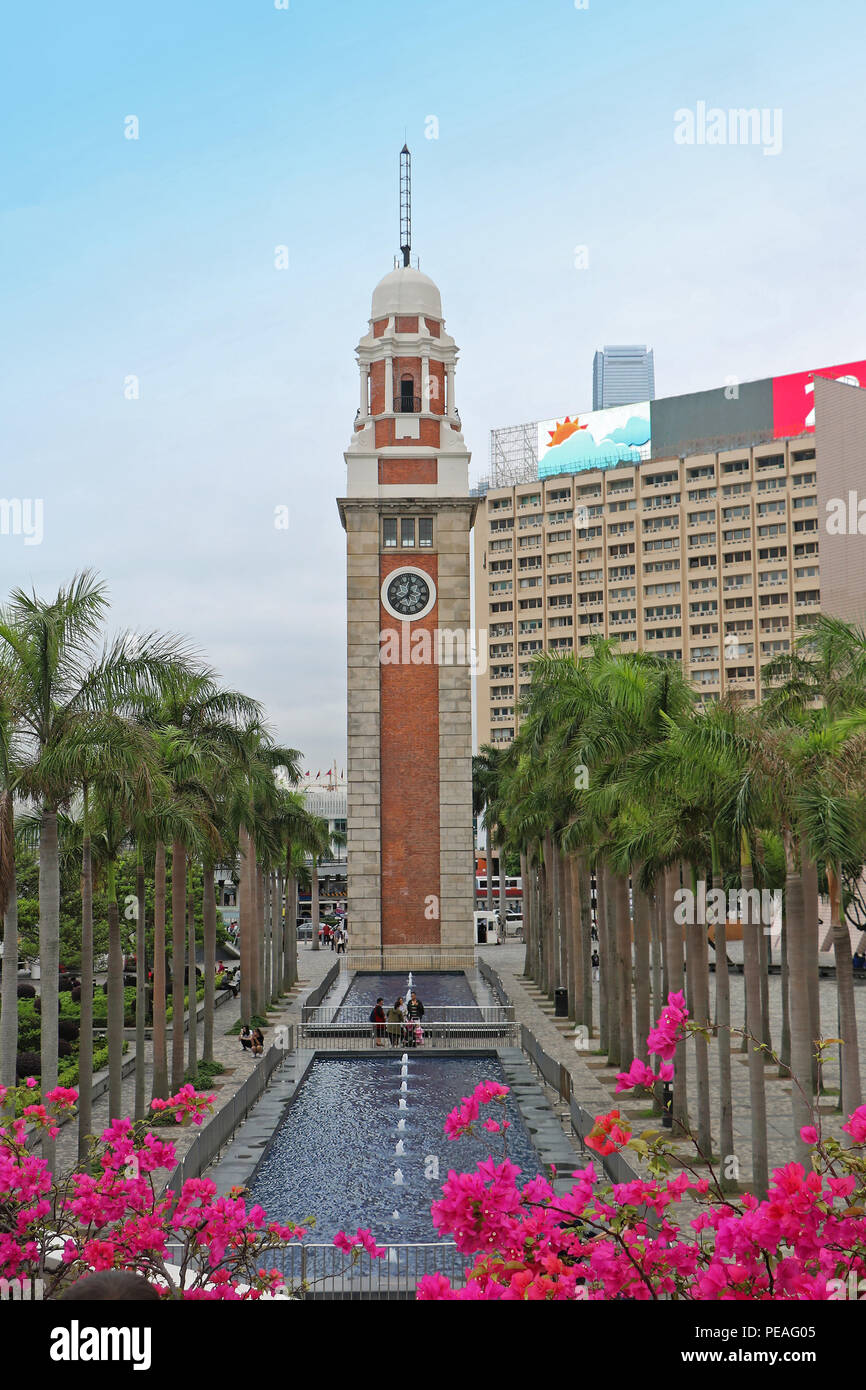 Hong Kong clock tower fountain landmark located in Kowloon with people