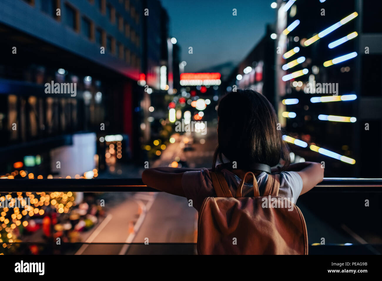 Woman street night rear view hi-res stock photography and images - Alamy