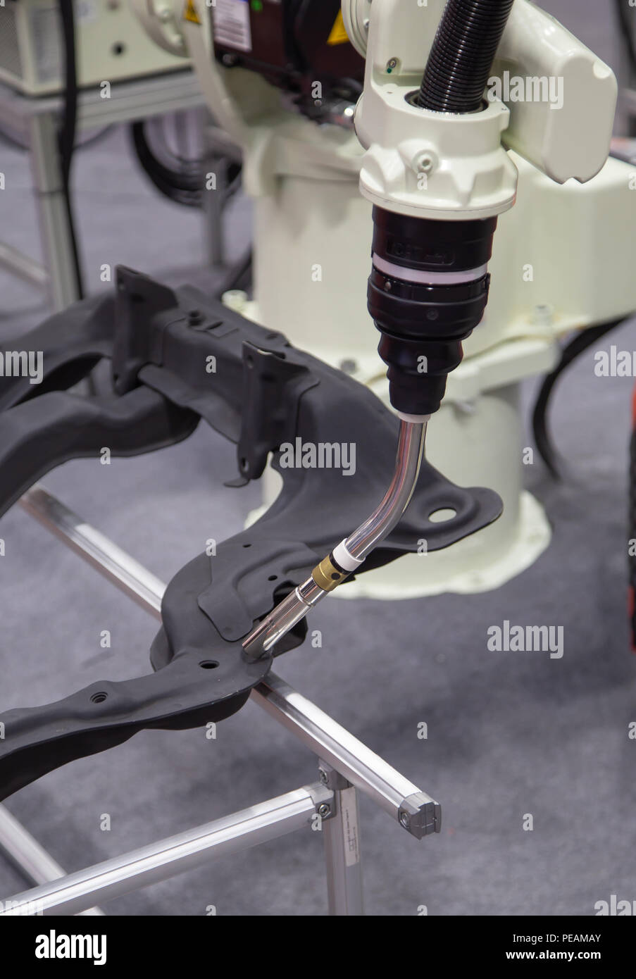 Automated robotic arm welding in automotive industry Stock Photo