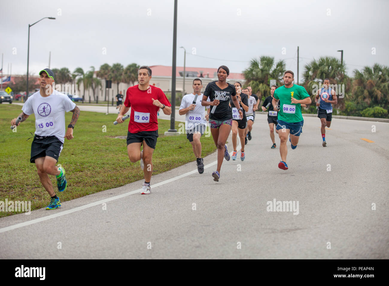 Participants and volunteers run the first one mile leg of the Mattar Relay race for the 35th Annual Mattar Relay, MacDill Air Force Base, Tampa, Fla., Nov. 20, 2015. U.S. Lt. Col. George Mattar, a Citadel alumni and former Joint Communications Support Element (JCSE) commander, was killed on Jan. 13, 1982, when his flight, Florida Airlines No. 90, crashed into the waters of the Potomac River. Aboard this flight were 74 passengers, of which only six survived. Also killed were Maj. Ralph Herman, JCSE's Chief of Operations, and Sgt. Maj. James Dixon. In commemoration, JCSE sponsors an annual 14 mi Stock Photo