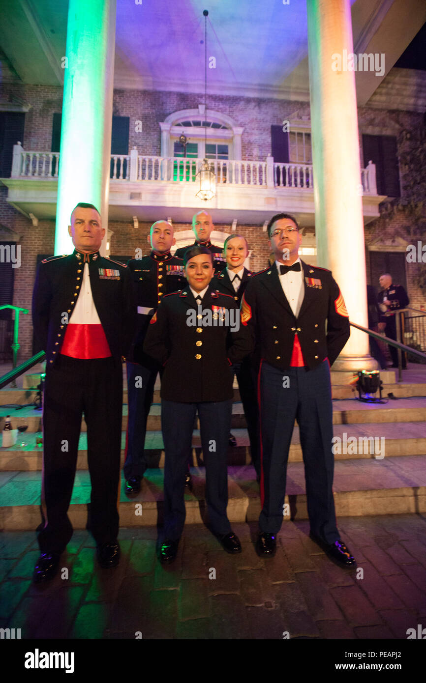 U.S. Marines with Combat Camera, Headquarters Battalion, Marine Forces Reserve, pose for a group photo before the celebration of the 240th Marine Corps Birthday Ball at Mardi Gras World, New Orleans, La., Nov. 21, 2015. This year’s celebration honors those past, present, and future Marines throughout history and marks the 240th Marine Corps Birthday since its founding on Nov. 10, 1775. (U.S. Marine Corps photo by Kimberly Aguirre/Released) Stock Photo
